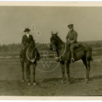Harry  Colebourn on horseback with friend